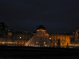 The floodlit pyramid at the Louvre, Paris